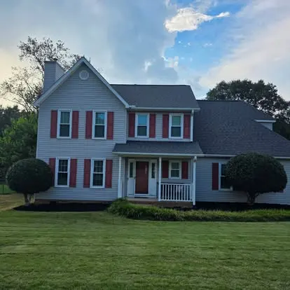 Freshly cut and striped front lawn along a driveway in an Upstate SC neighborhood